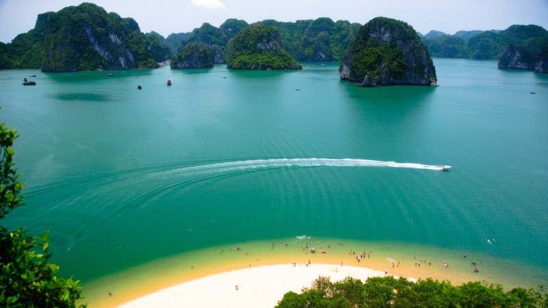 Immerse yourself in emerald water on the moon-shaped beach