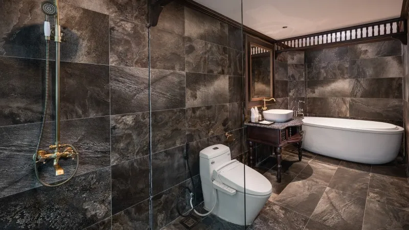 The spacious bathroom with amenities