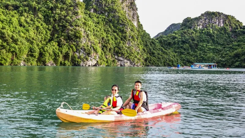 Kayaking On The Tranquil Water Of Halong Bay