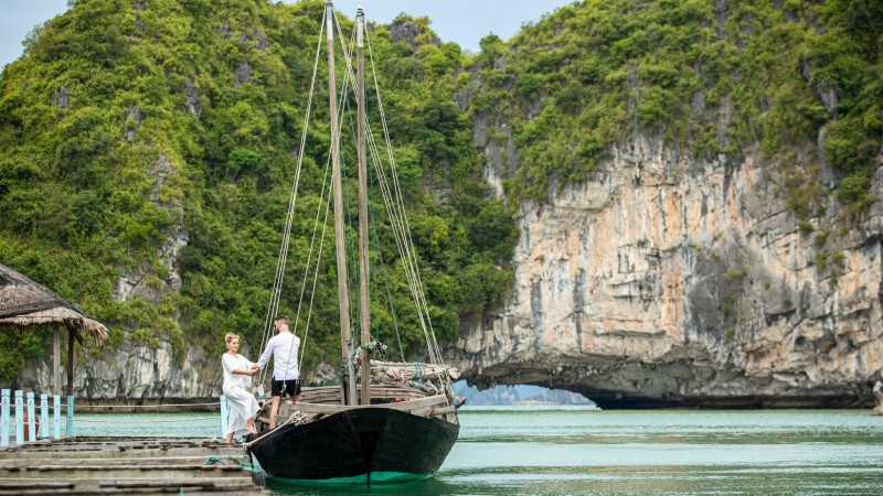 Explore Luon Cave's majestic landscape with a harmonious blend of sea, sky, and islands