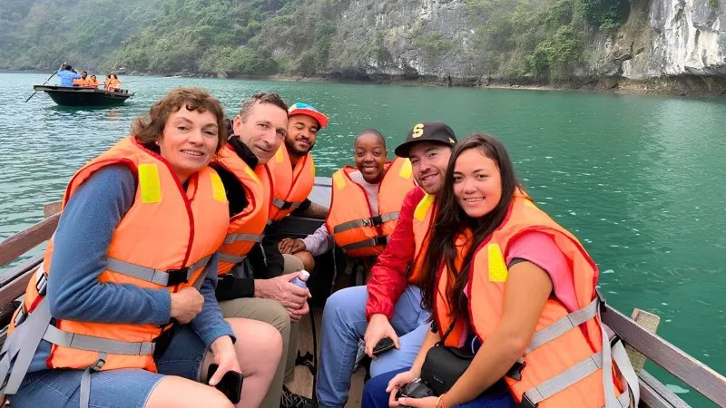 Rowing boat to Dark & Bright Cave