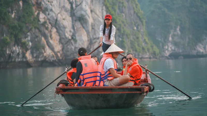 Floating on green Halong Bay's stream