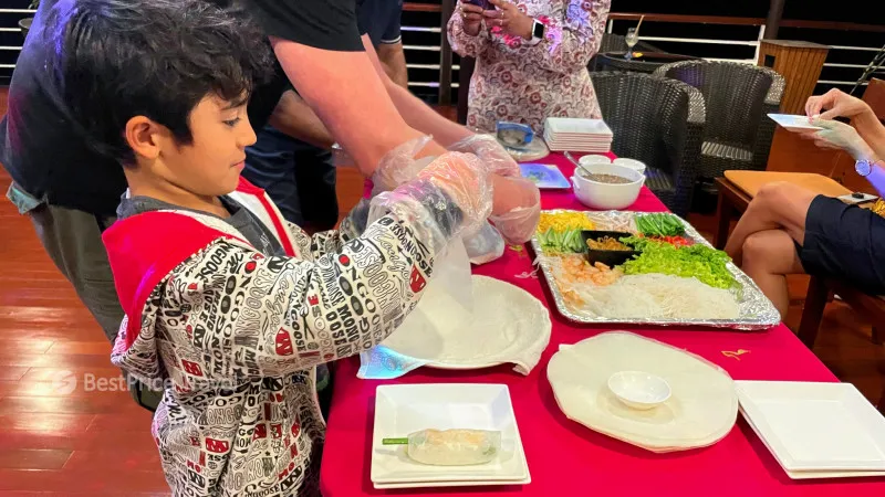 Kid enjoying Vietnamese cooking class
