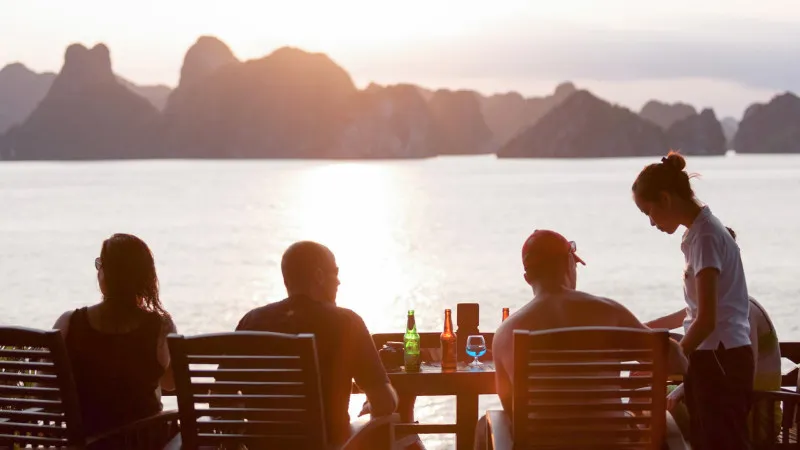 Enjoys sunset drinks with fellows