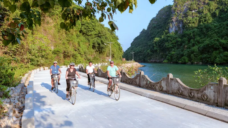 Cycling through winding Viet Hai village road