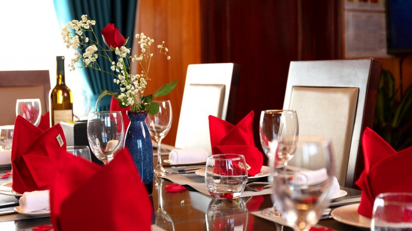 Melody Private Cruise: Elegant dining table set arrangement