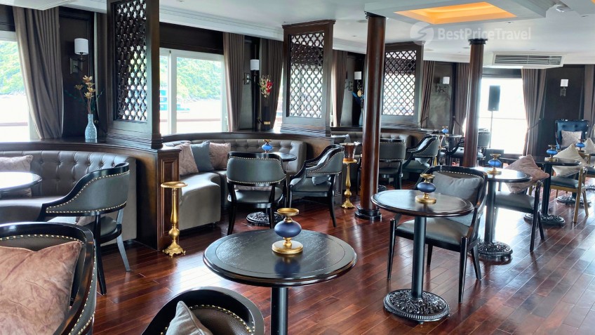 Paradise Grand Cruise: Luminous Lounge with Wooden Furniture