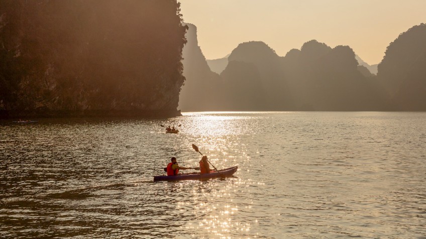 Kayaking under Lan Ha Bay's sunset