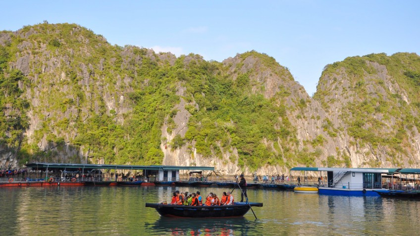 Rowing boat to Dark & Bright Cave