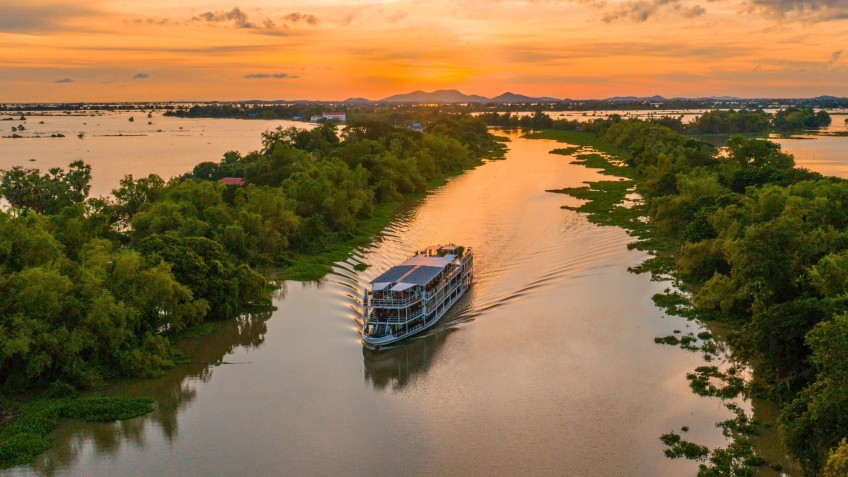 RV Lan Diep Sailing Through Mekong Landscape