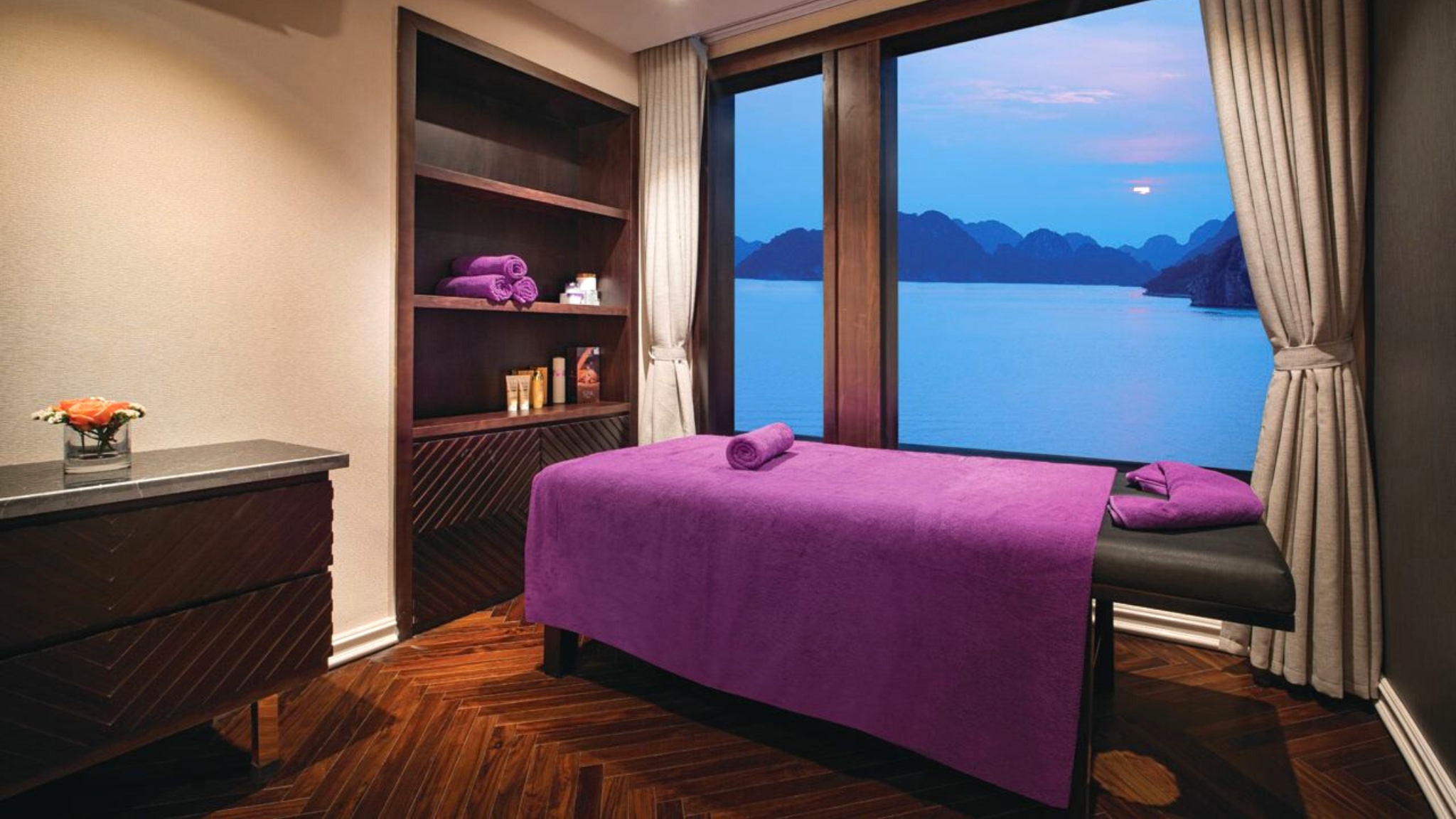 The spa room offers a cozy space with awe-inspiring Halong Bay views.