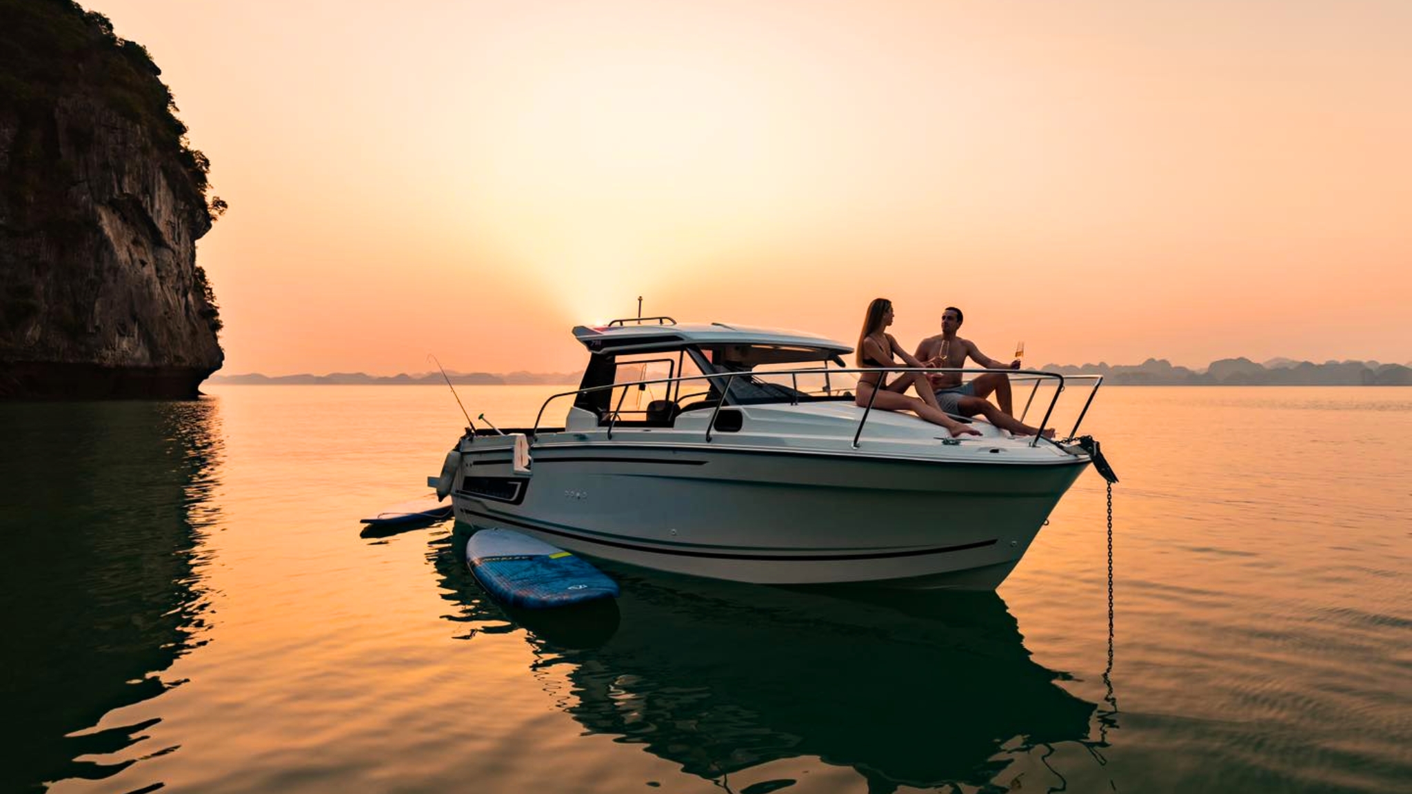 Soak up the sunset and get a taste of tropical juice served by the cruise staff