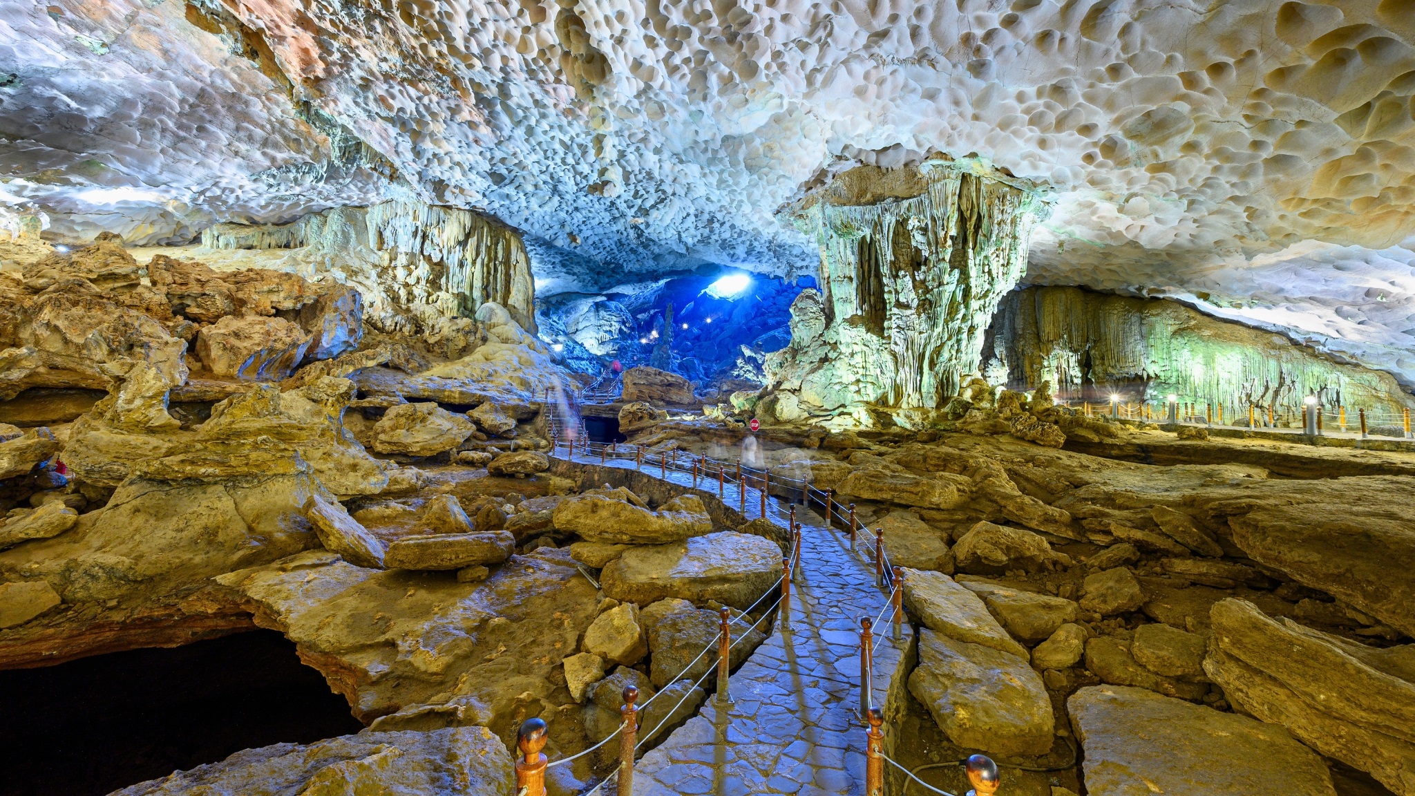 Admire the mesmerizing stalactites and stalagmites of Sung Sot Cave