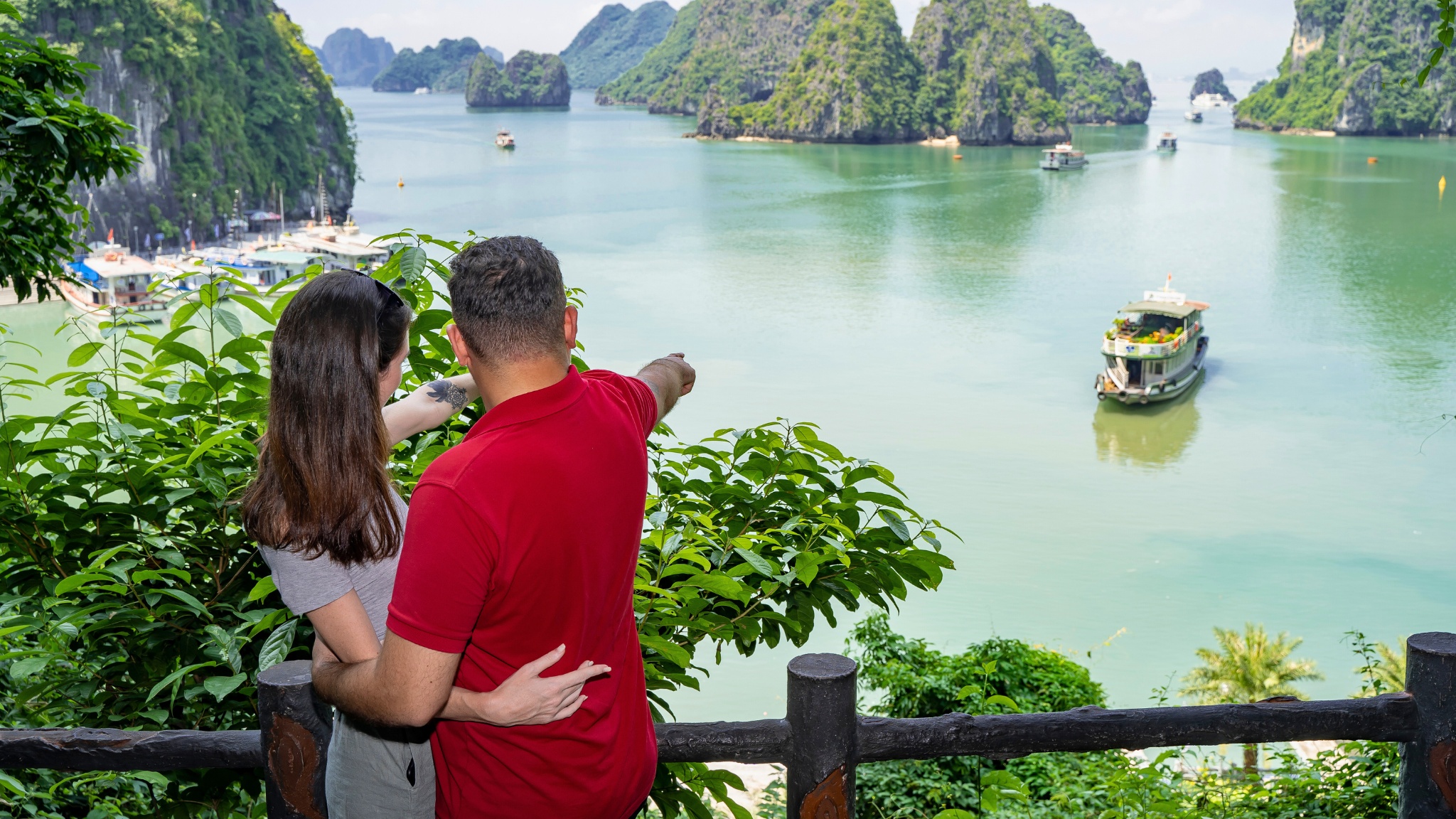 Travelers may hike to the mountaintop of Titop Island for a panoramic view of the bay