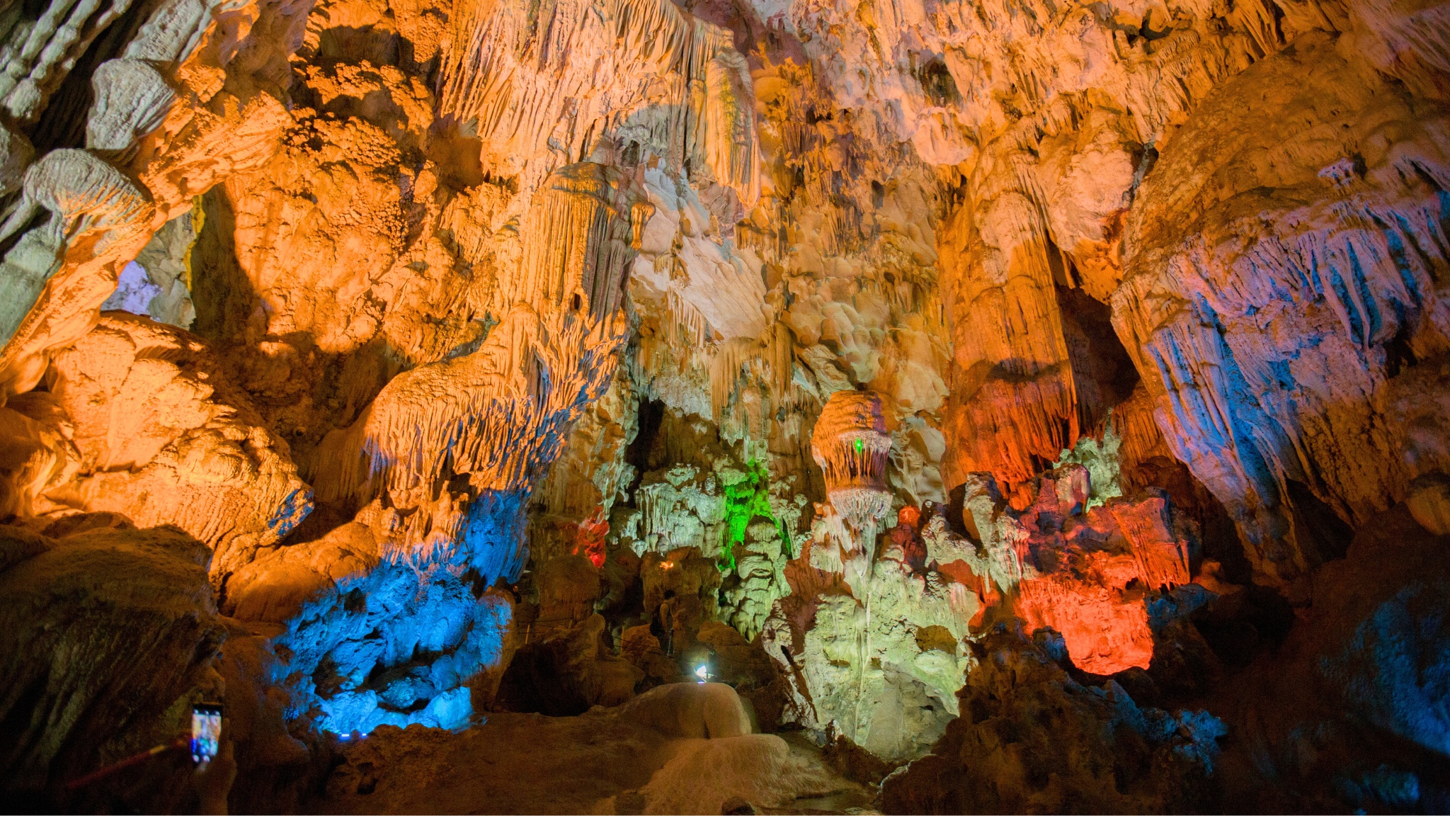 Outstanding stalactites of Me Cung Cave, sparkle under colorful lights