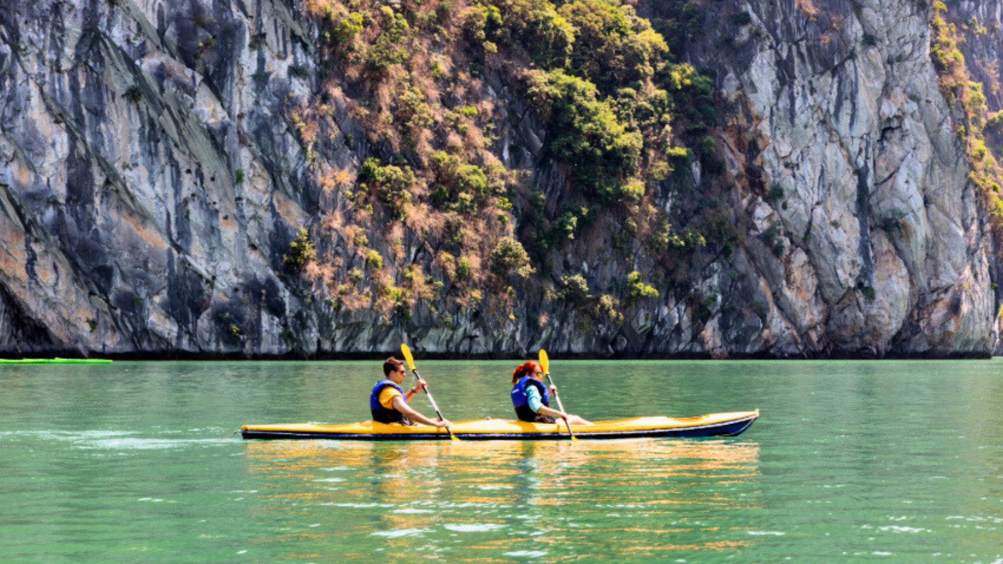 Let&rsquo;s join a fun kayaking experience to explore Halong Bay limestone caves.