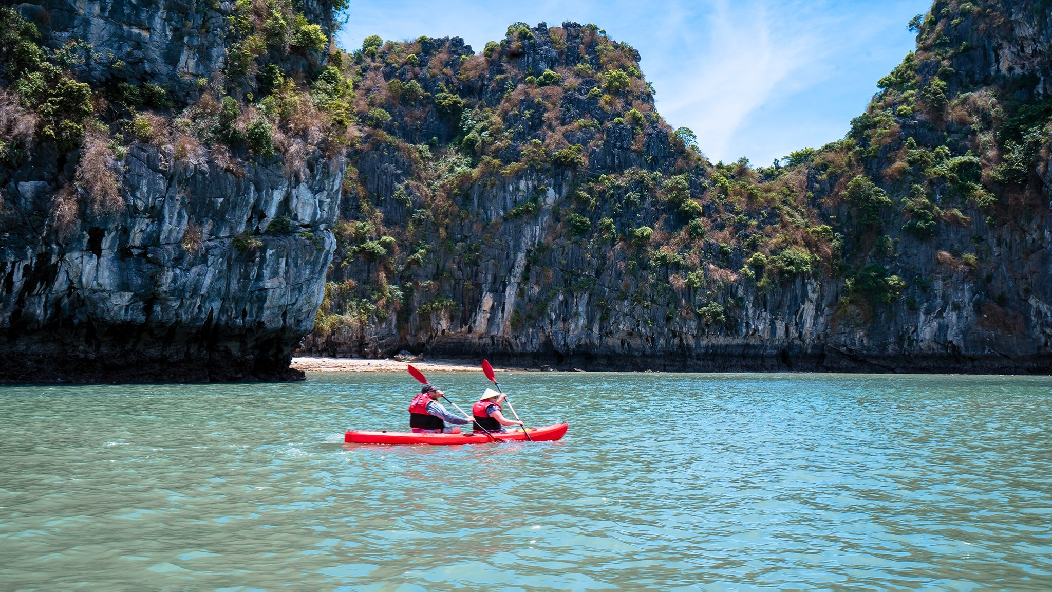 The clear emerald water of Ba Trai Dao Beach perfect for swimming and kayaking