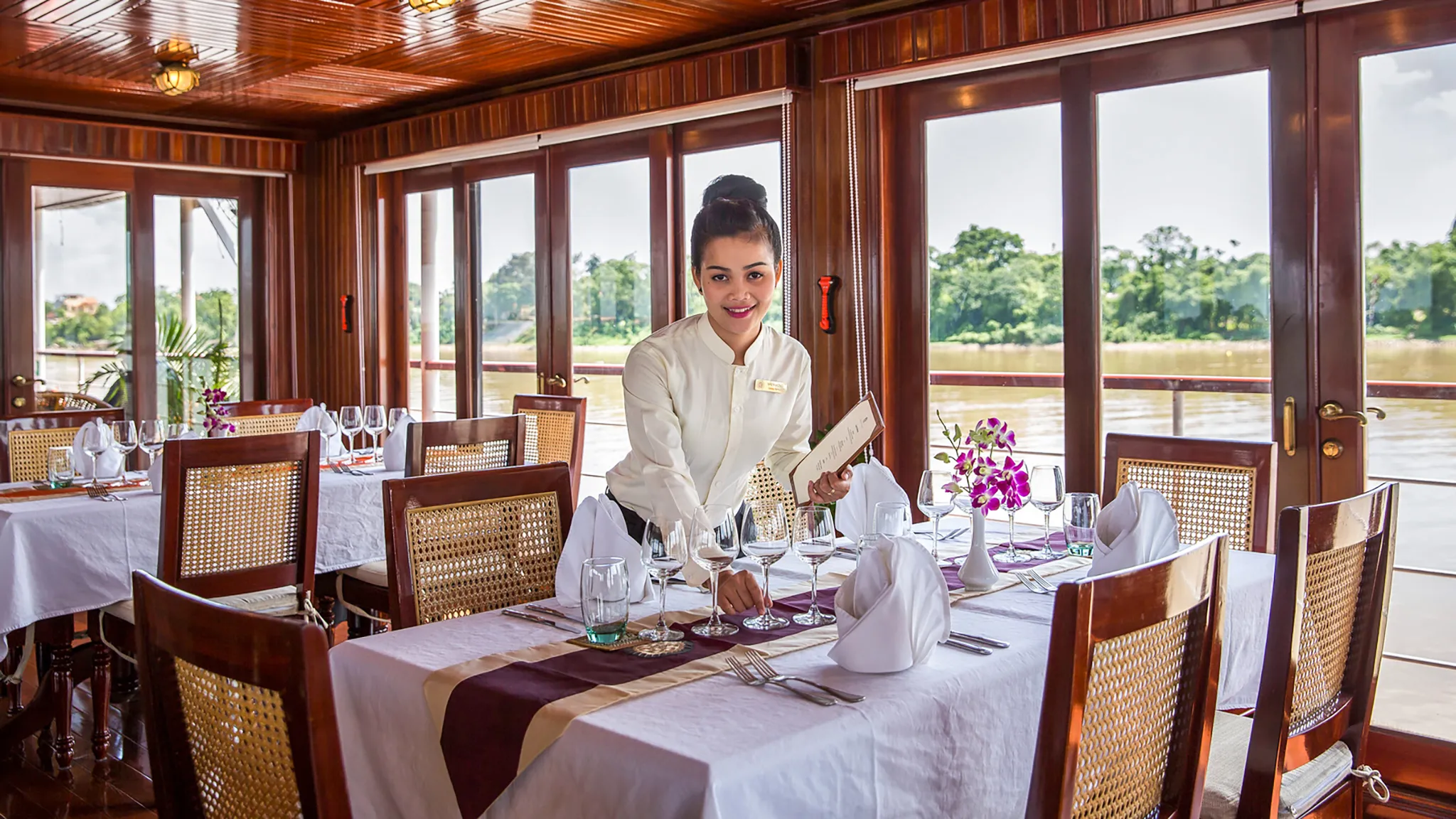 Beautiful Staff Prepares Dinning Table