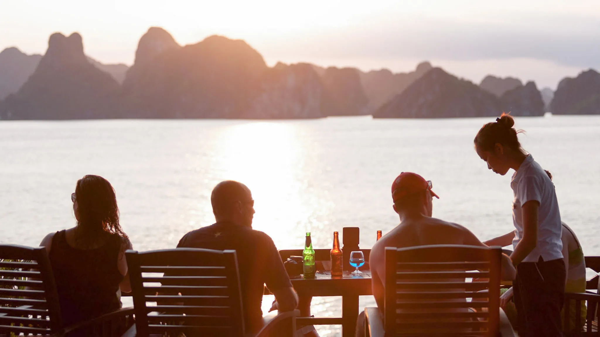 Enjoys sunset drinks with fellows