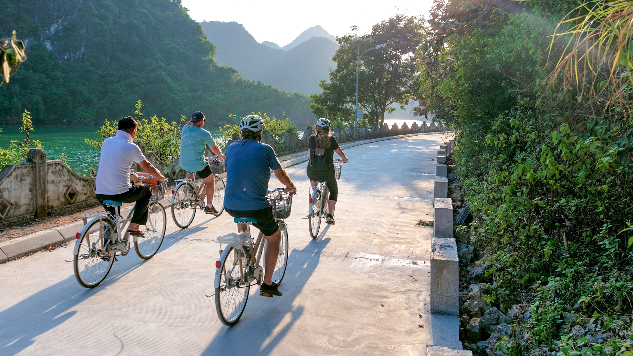 Cycling along a winding road on Cat Ba Island