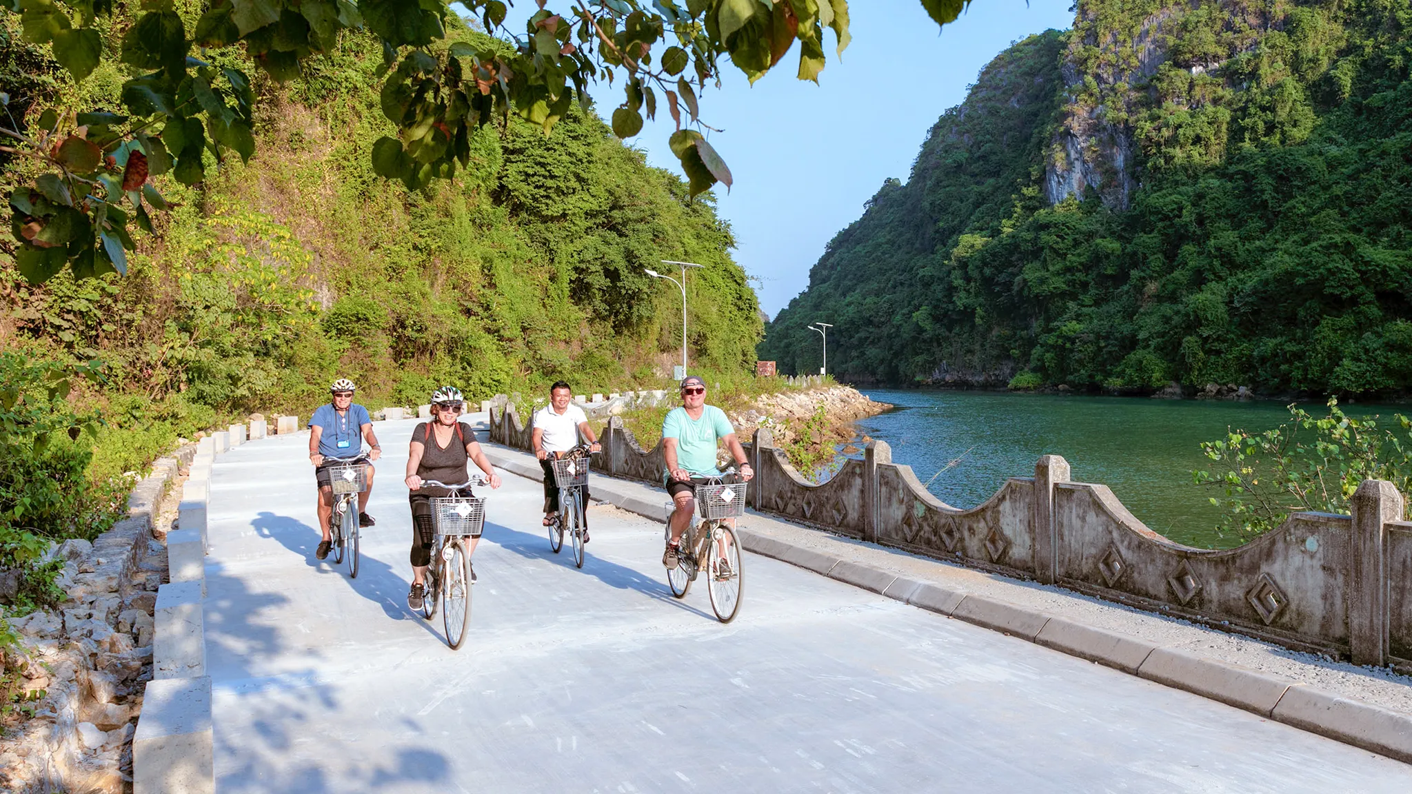 Cycling through winding Viet Hai village road