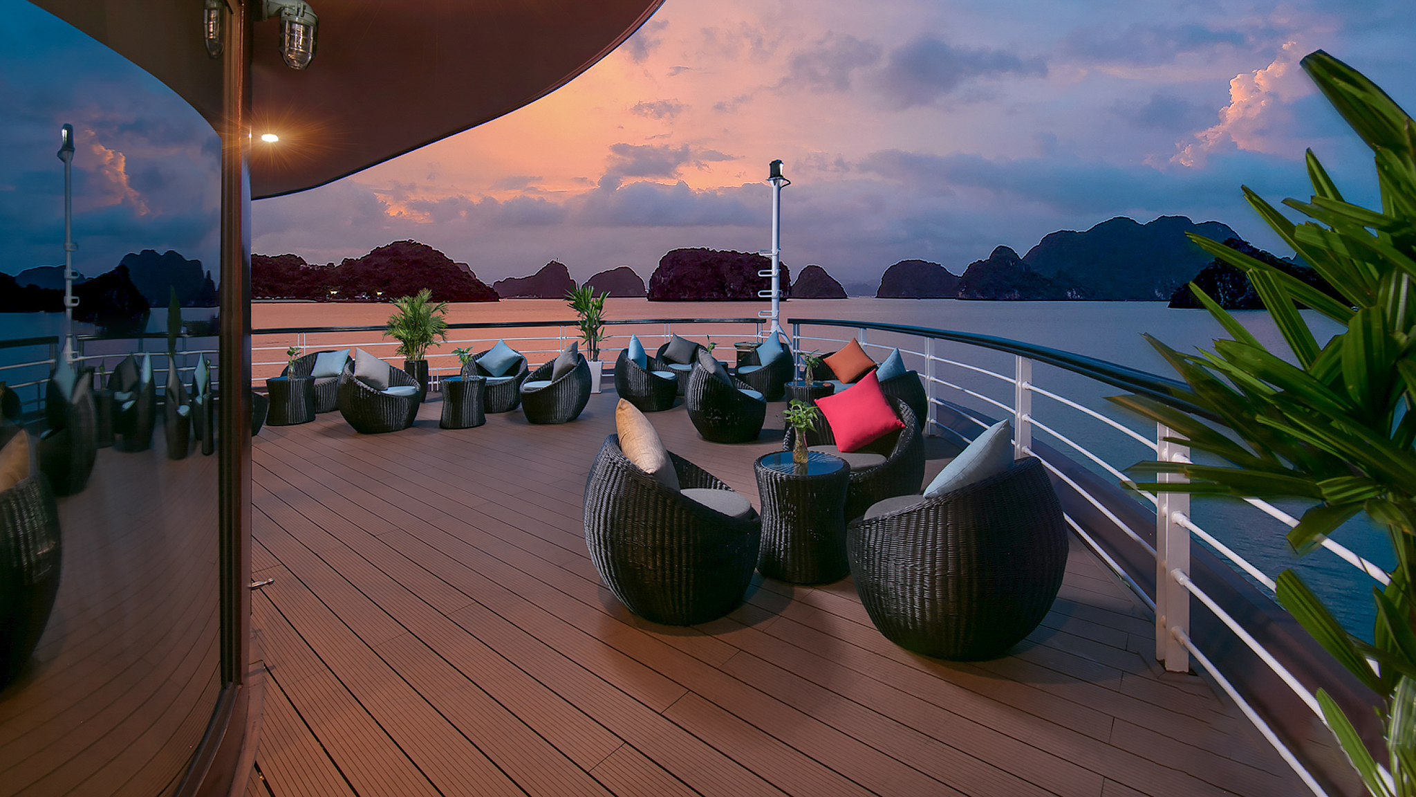 Feast your eye on the stunning sunset and sip a cocktail at Happy Hour