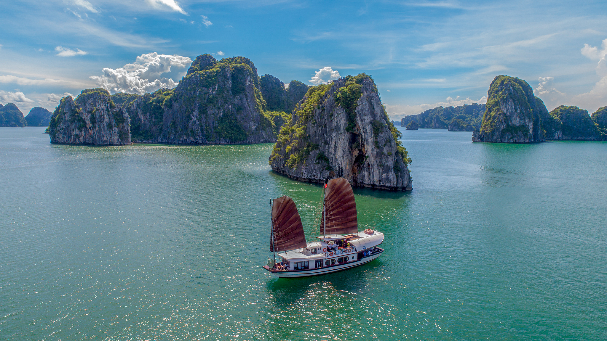 Prince cruise amid sunlit Bai Tu Long bay