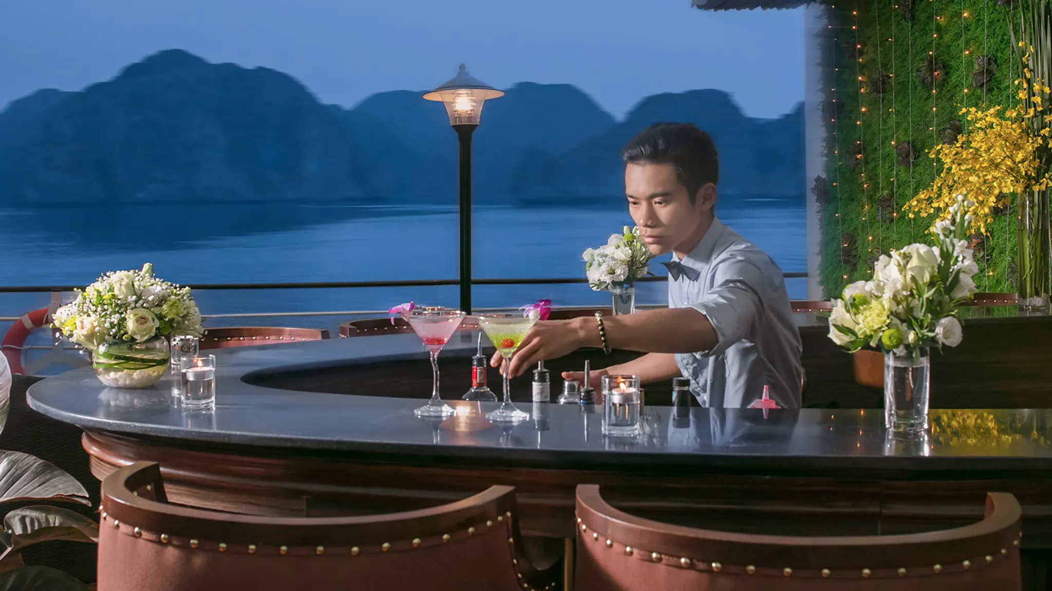 Sip on drink at outdoor bar