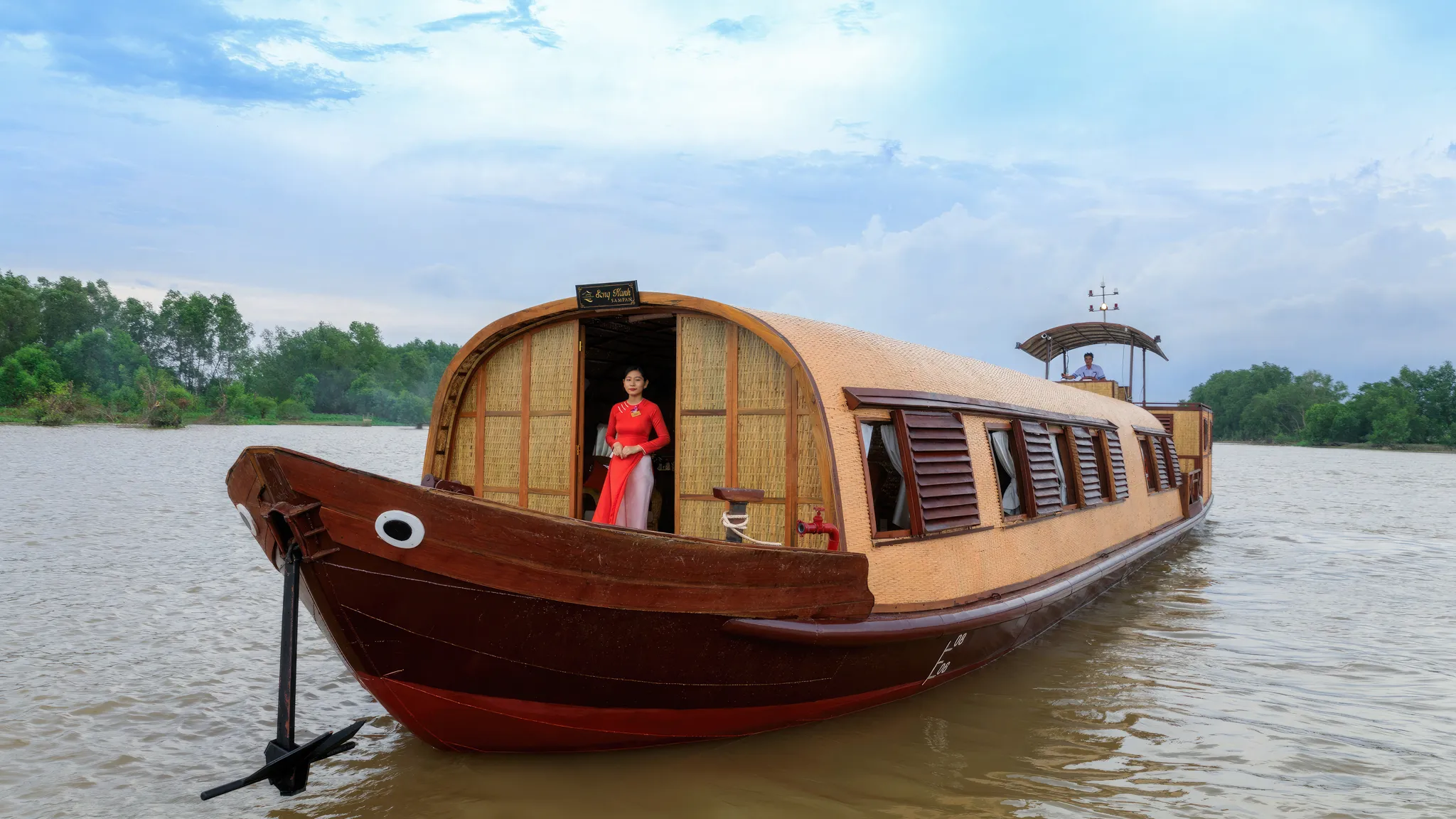 Staff On Mekong River Sampan