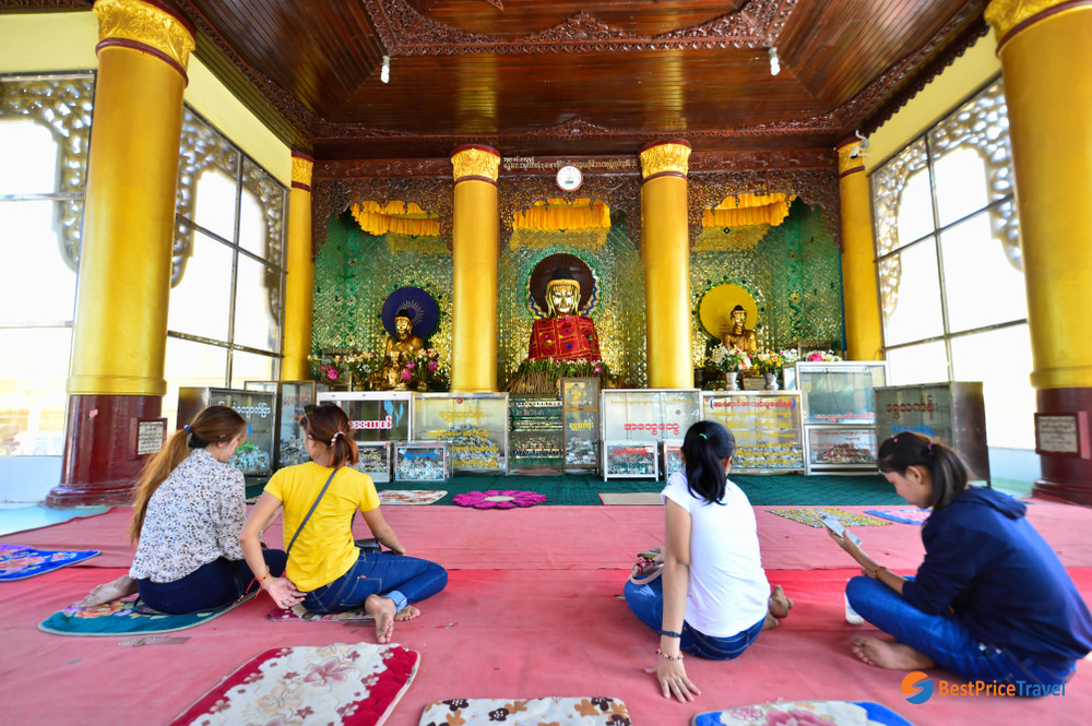 Kneel In Front Of A Buddha Statue