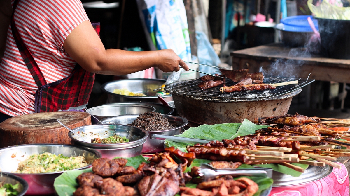 A Seller Prepare Delectable Culinary In Luang Prabang