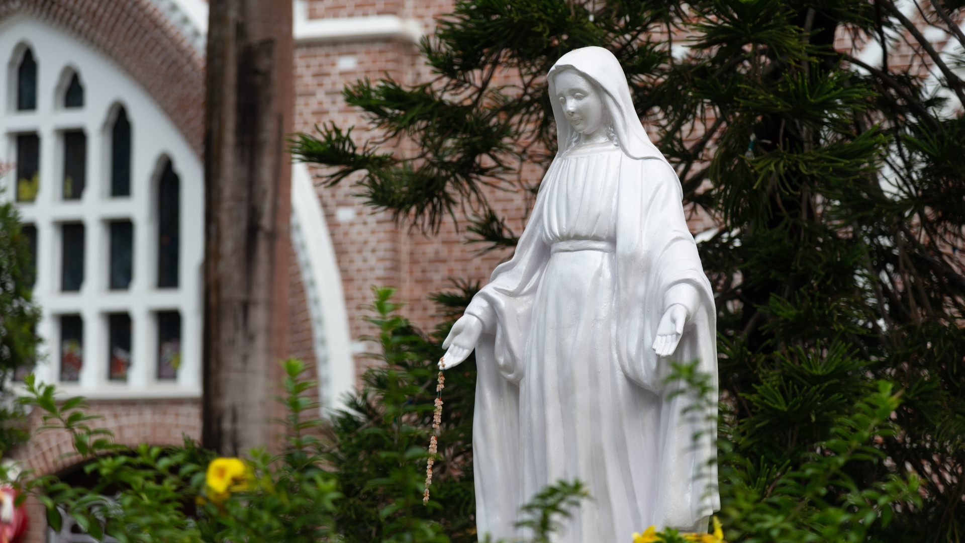 A Stone Statue At Saint Mary's Cathedral Yangon
