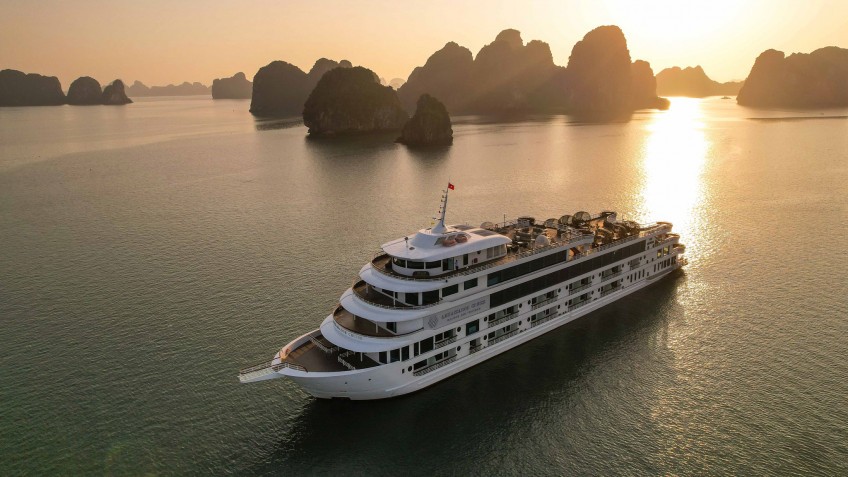 Wake up to sunrise over the serene bay aboard a luxury cruise