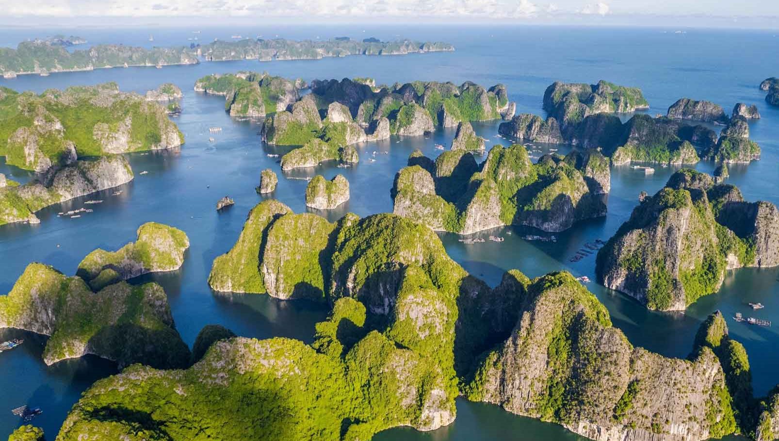 Towering limestone karsts rise majestically from emerald waters