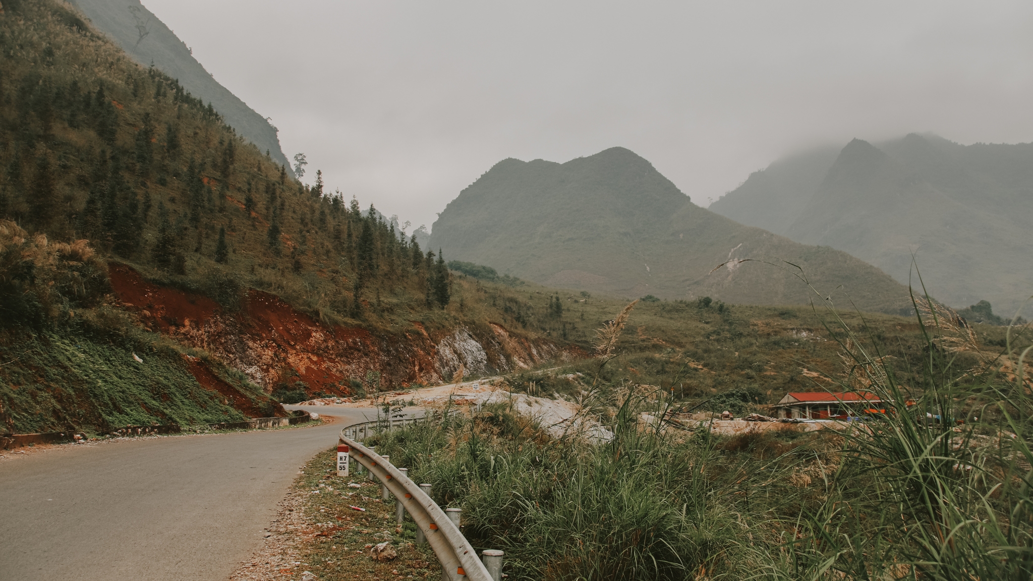 Winding Mountain Road Snaking Through Meo Vac Landscapes