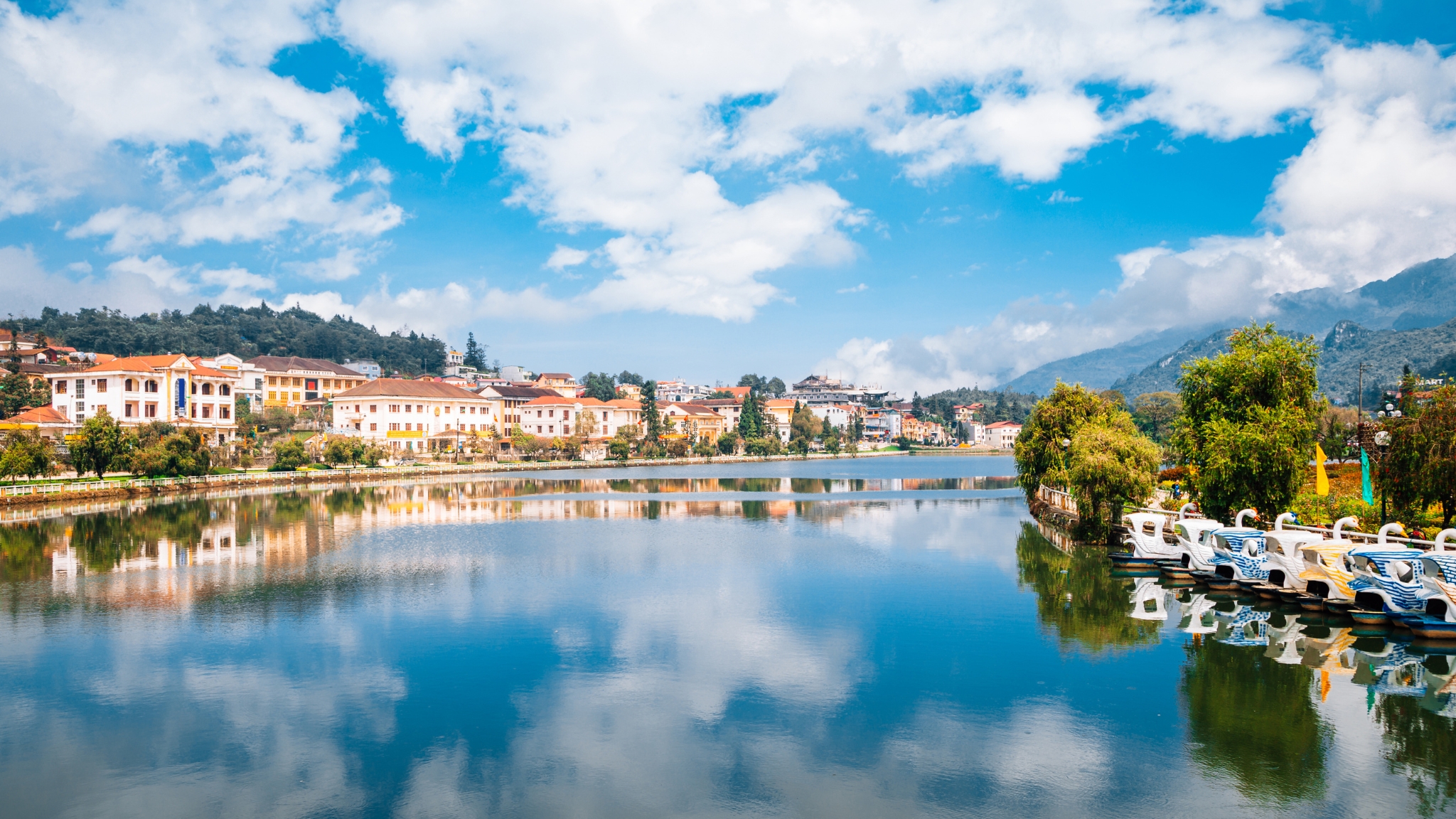 Calm Waters Of Sapa Lake Surrounded By Greenery