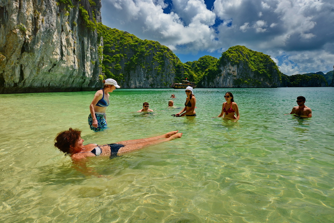 Swimming and sunbathing in Halong