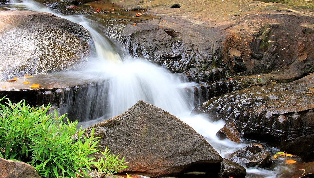 Lingas And Sculptures Of Hindu Gods And Waterfall At Kbal Spean