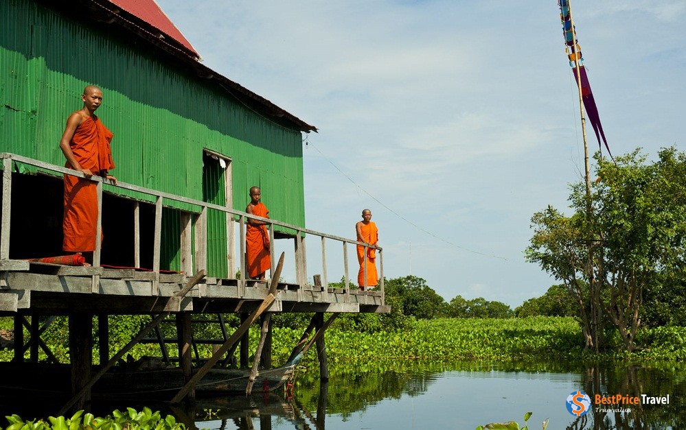 Cambodian monks in a "floating village"