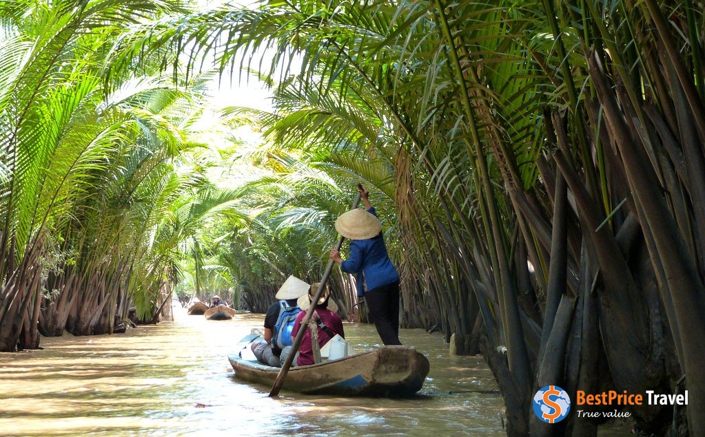 Leisurely boat trip along narrow canals in Mekong Delta