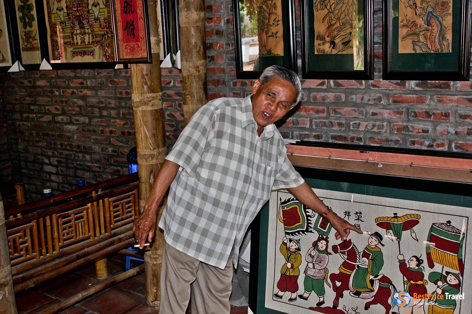 Local artisan explaining the concept of the painting.