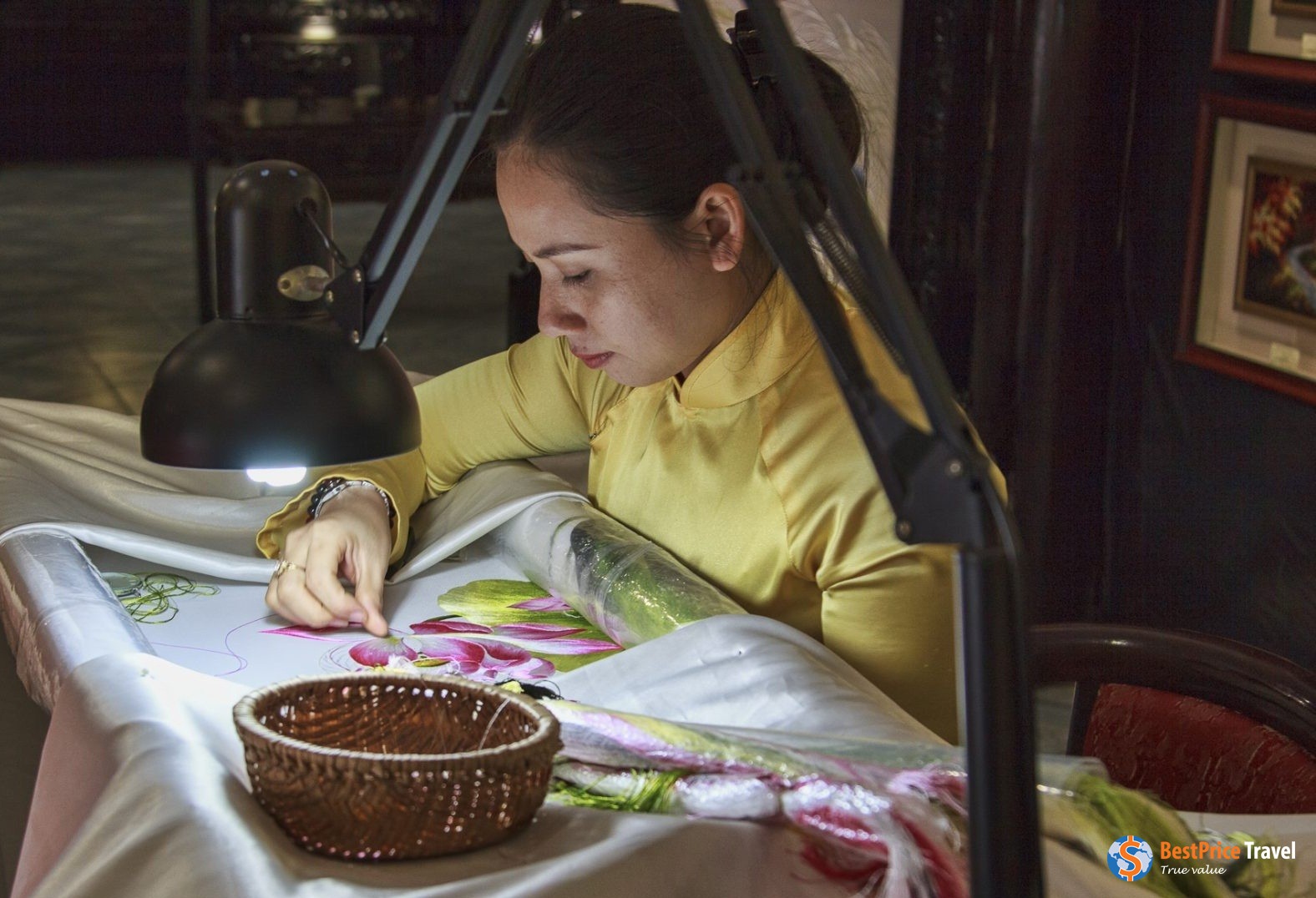 Lady at work in XQ Historical Embroidery Village Nha Trang.