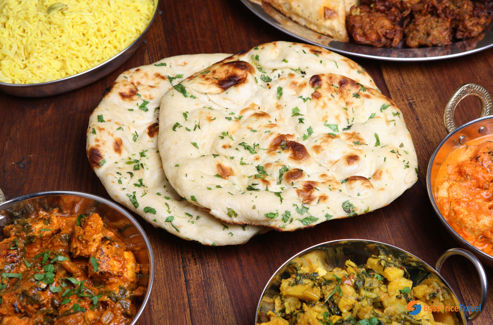 Naan bread, flavored with garlic and fresh coriander - Vietnam’s Best Indian Restaurants