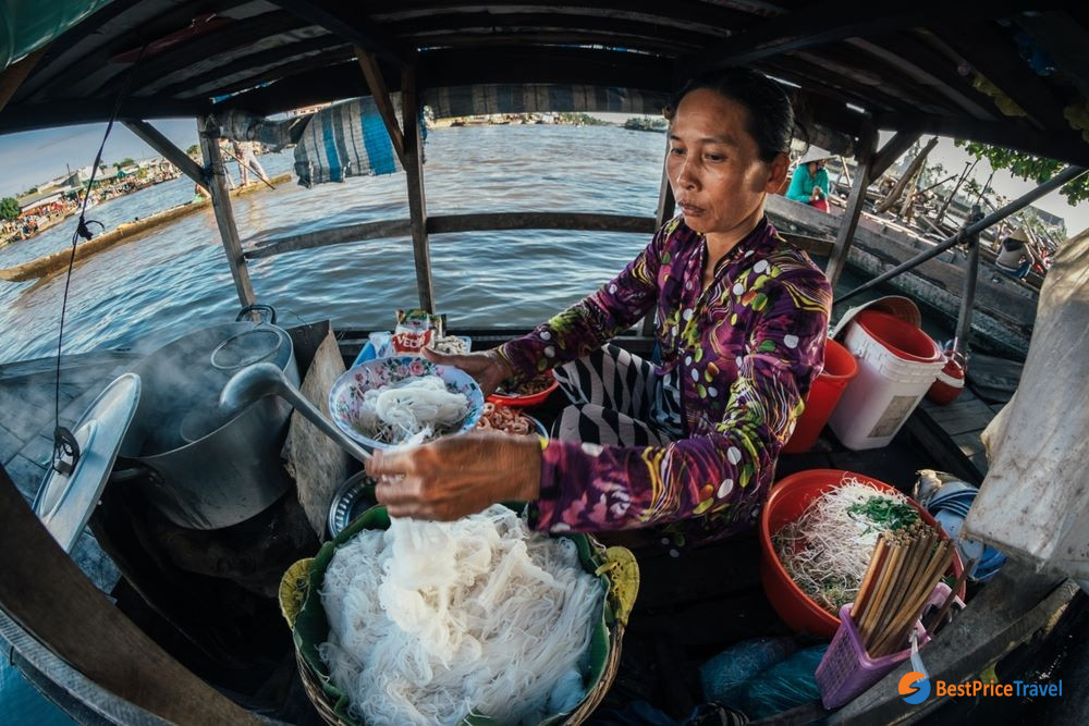Having Breakfast On The River at Nga Nam floating market