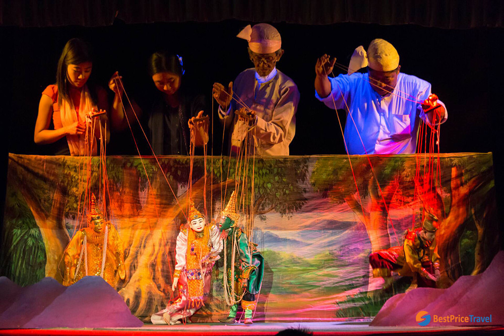 Wooden puppet with exquisite clothes controlled by skilled puppeteers