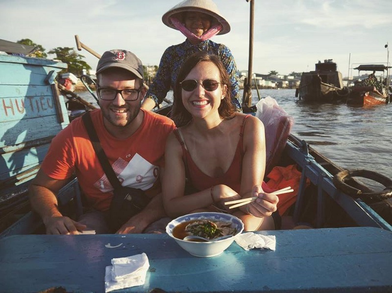 Having Pho noodle on the sampan in Cai Rang floating market
