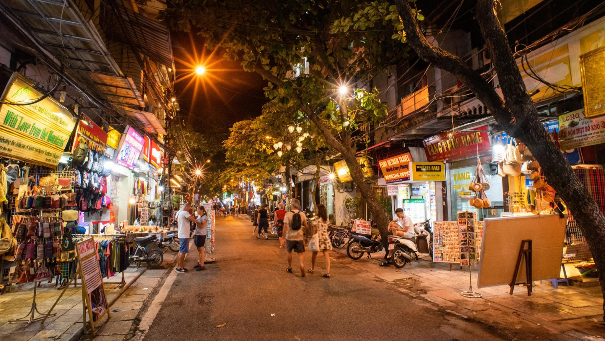 Old Quarter comes alive at night with bustling crowds and vibrant street food