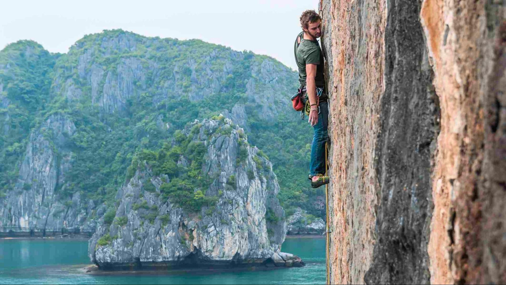 Conquer the towering limestone cliffs in Halong Bay