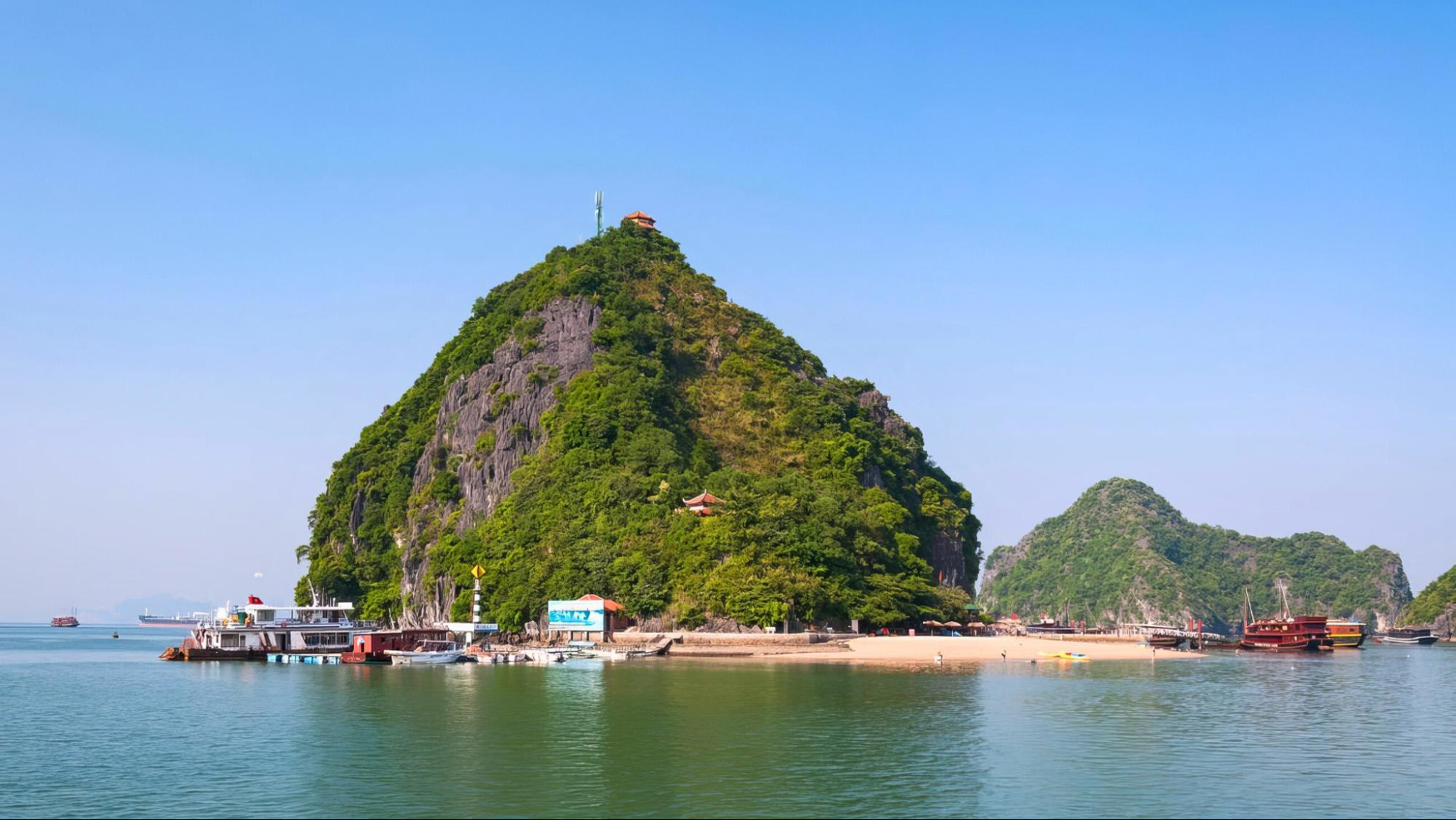 The vibrant sunset colors blend in with the stunning landscapes of Titop Island