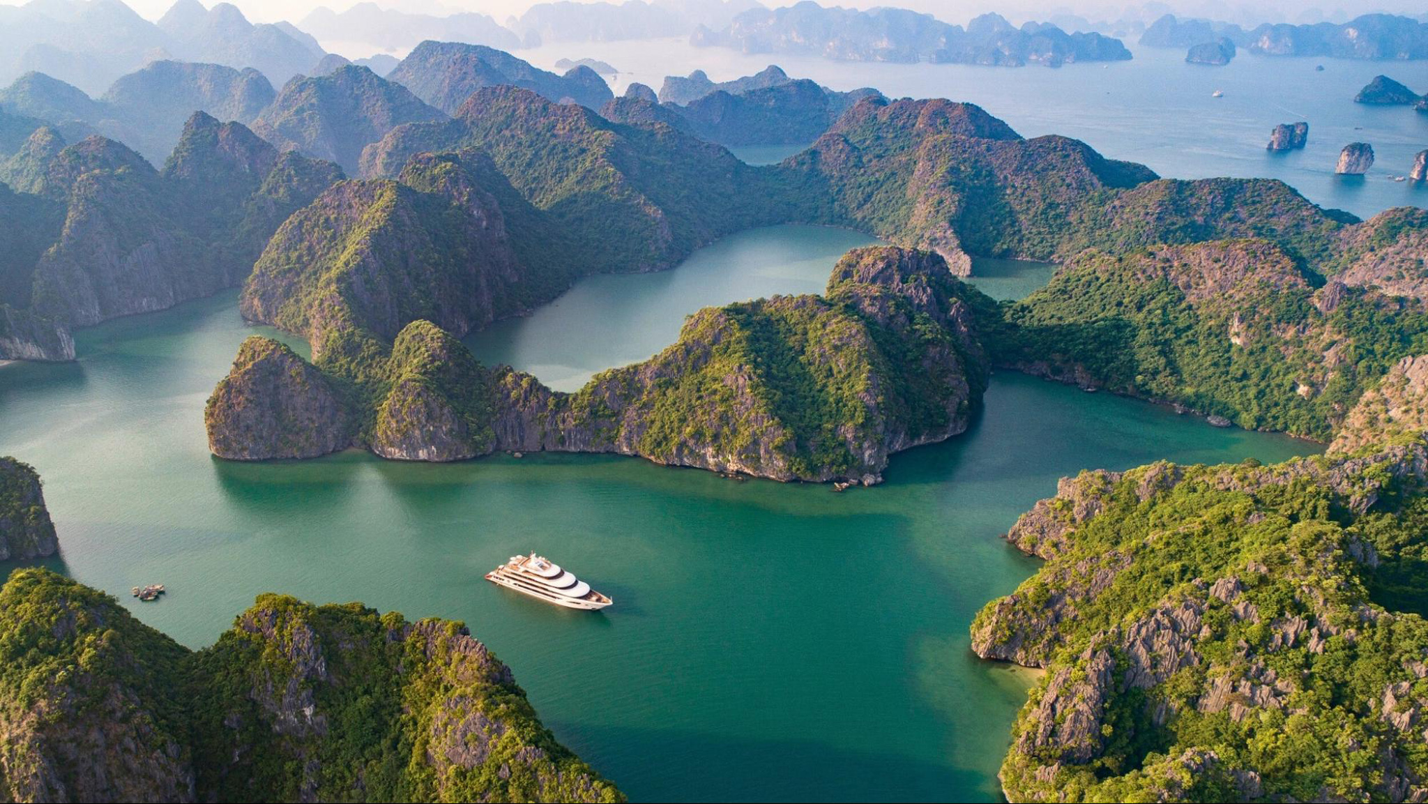 Halong Bay offers breathtaking views with limestone cliffs and emerald waters